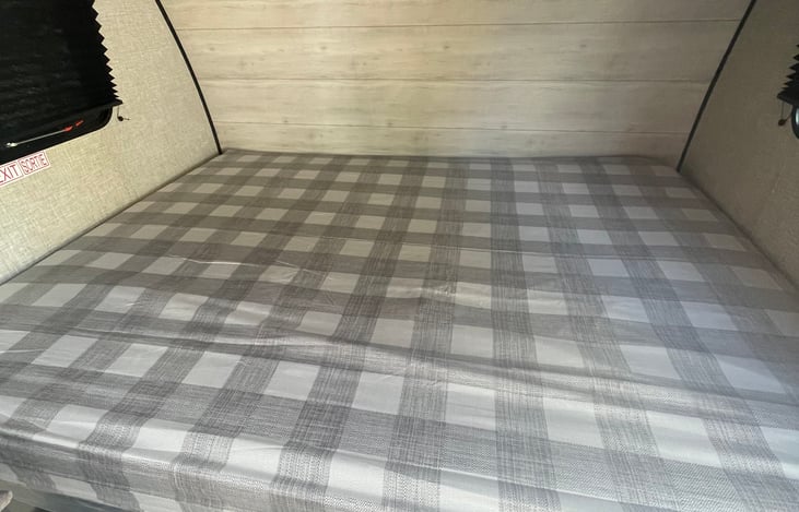 Queen size bed with linen mattress fit cover. Mattress is in excellent condition. Like new.