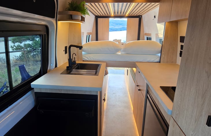Drop down hydraulic bed makes it easy to sleep, clean up, and have adventures!