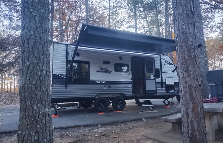 Another view of the camper with awning extended.