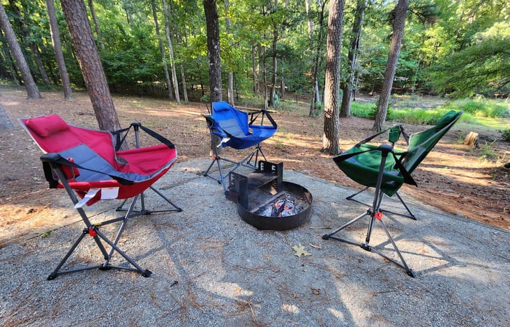 Outdoor campfire enjoyment with rocking lounge chairs.