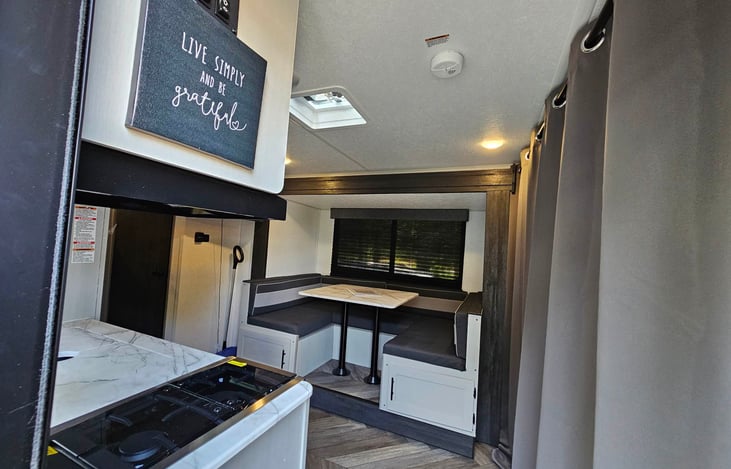 Curtain closed (couch/master bed behind it). View from front door.