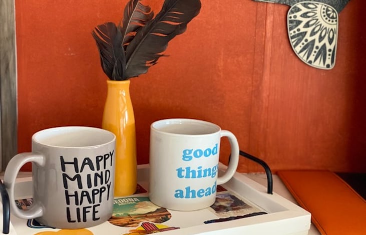 Real coffee mugs provided.