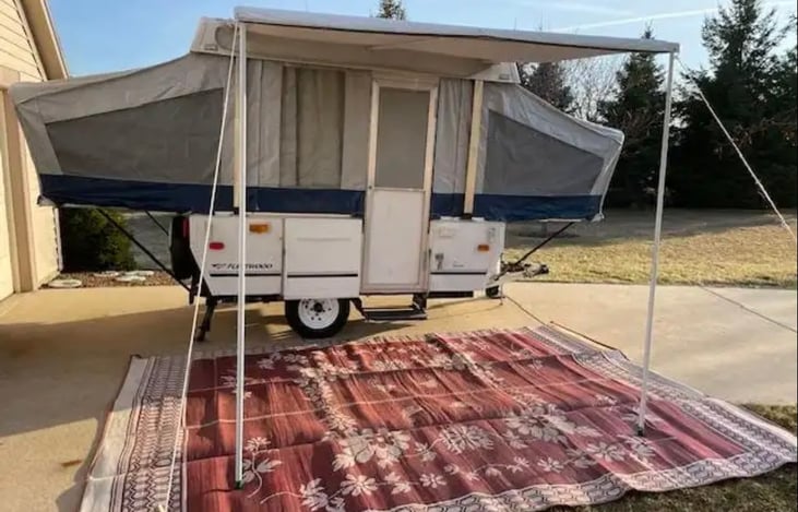 Canvas and awing are in excellent condition with no tears or rips. Camper includes an outdoor camping mat as pictured.