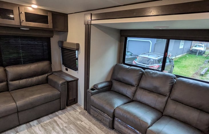 The left couch folds out to cover most of the living area as a bed.