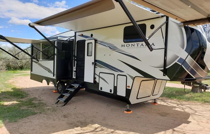Two awnings with lights. Outdoor speakers. Comes with a Onan propane generator for boondocking. It will power the entire rig! Lawn chairs in the belly of the camper.