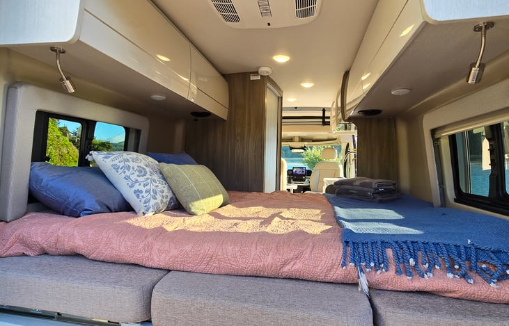 King bed in slide out position with additional provided foam bedding.