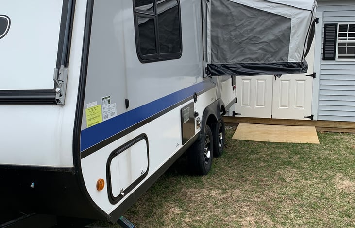 View of outside of camper with pop out bed