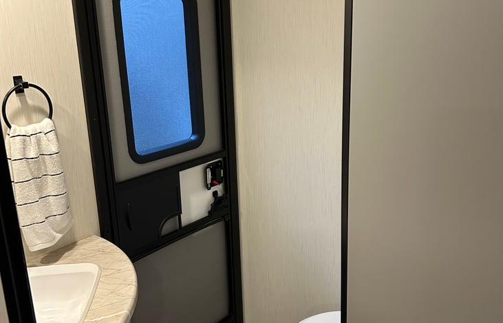 A unique feature to our camper is this extra half bathroom with outdoor access