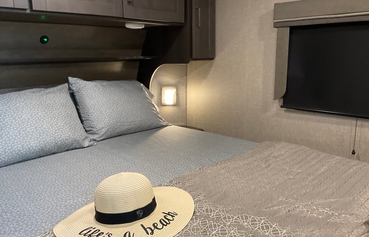 Room darkening shades are a welcome edition for napping during the day or for privacy at night.