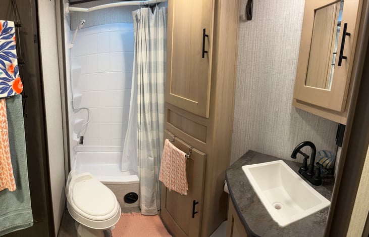 Shower with strong water pressure and an on/off switch on the shower head to help conserve hot water.