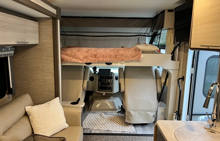 Over the front cab a motorized twin bed with ladder making a prefect spot for extra sleeping.