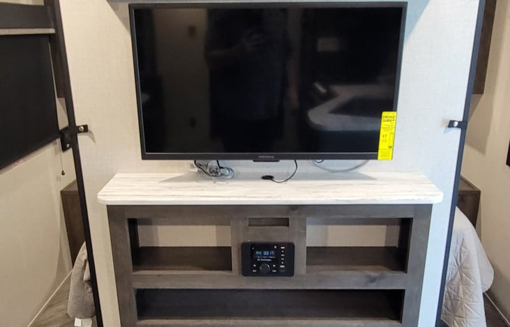 Tv, Stereo System and Fireplace