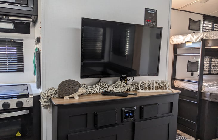 Flat-screen TV with Bluetooth Entertainment System boasting indoor and outdoor speakers!