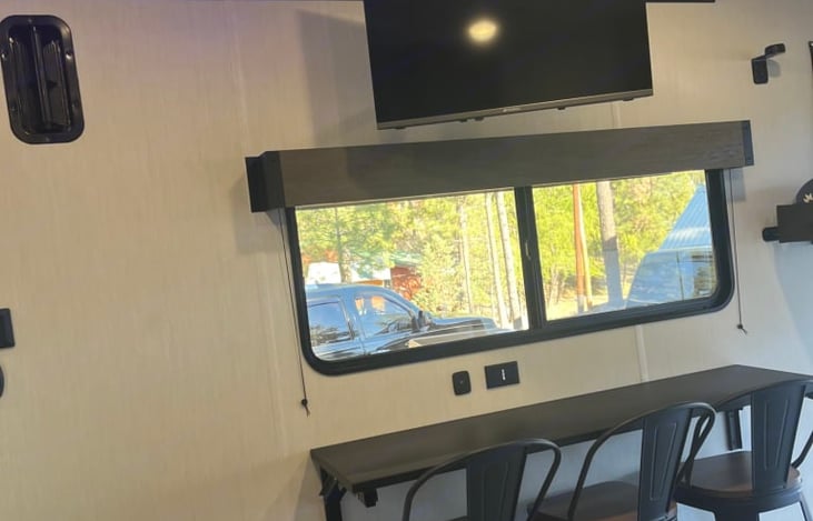 Fold out bar for when you need to use it and folds down when you want more space in the area.