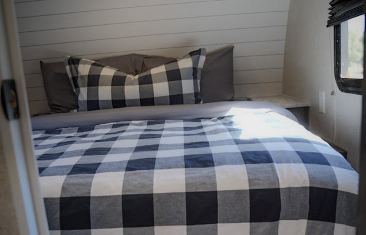 spacious queen sized master suite offers comfort and storage with operable windows on each side of the bed to feel the breeze and stay connected with the outdoors.