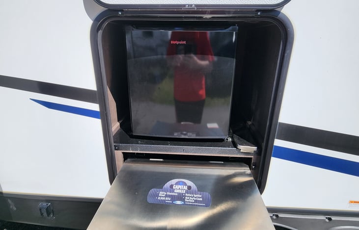 Outside fridge and grill.