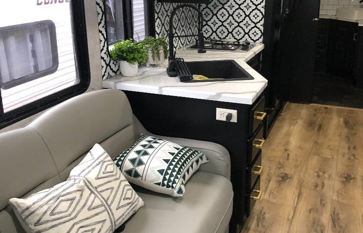 Sofa and kitchen area.