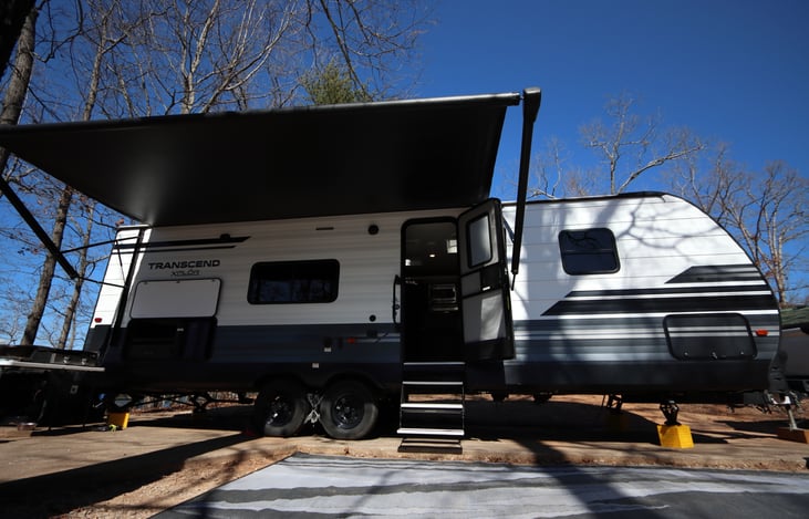 Spacious Living Room with Outdoor Kitchen and Full Kitchen. The Sofa is a Pull-Out Bed, and the Dining Table is a Convertible Bed. The outdoor rug comes with every rental!