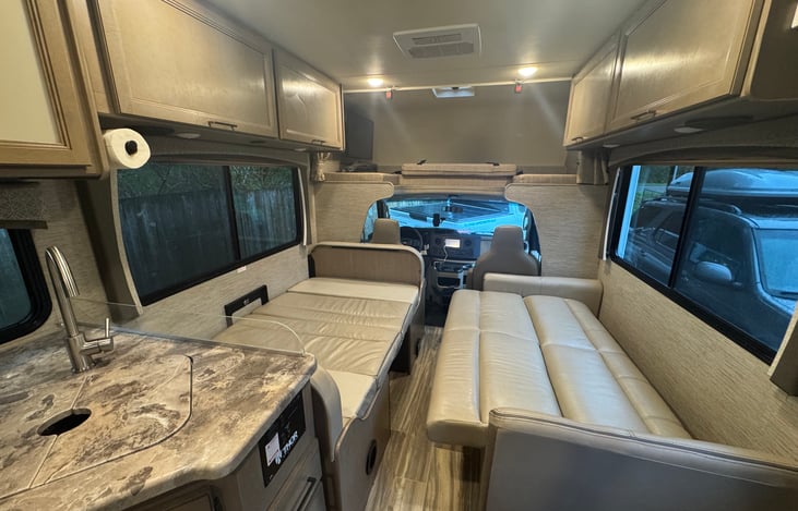 Dinette and couch folded into sleep arrangements