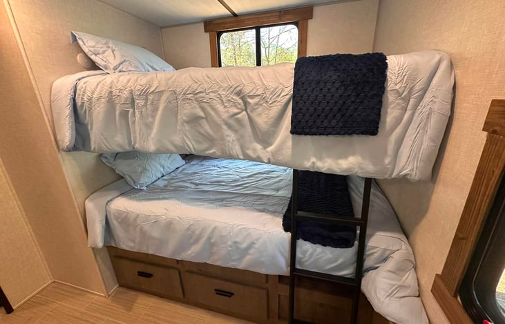 Top and bottom bunks in bunkroom.  Window coverings have been added to all windows in bunkroom.