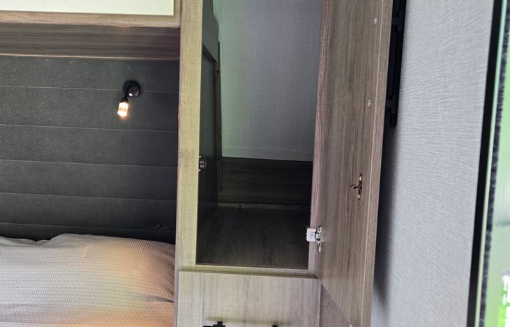 Closet and drawers on each side of the bed