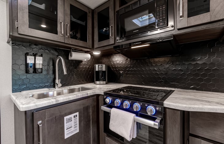 Equipped with a stove top, oven, microwave, and coffee maker, enjoy the comforts of home while exploring the outdoors!