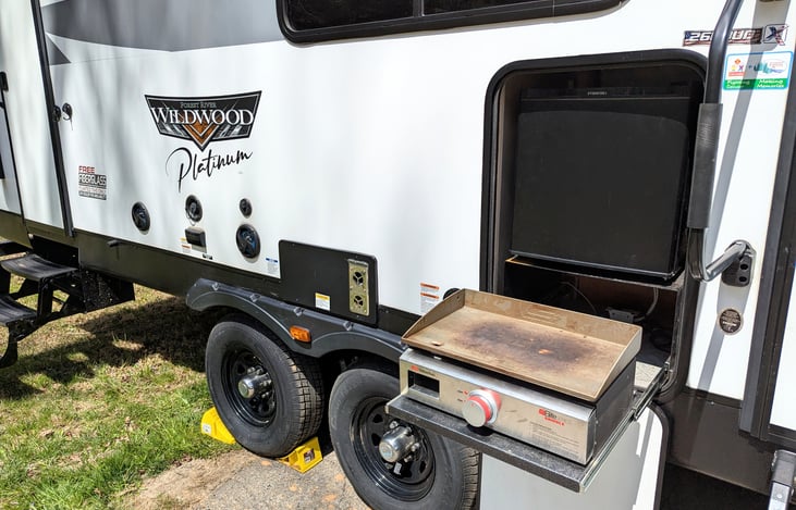 2023 Wildwood Platinum: Luxury family-ready rig with a King Master, double bunks, and Versa-Lounge. Enjoy the fireplace, bright modern interior, panoramic windows, outdoor kitchen large awning and mor