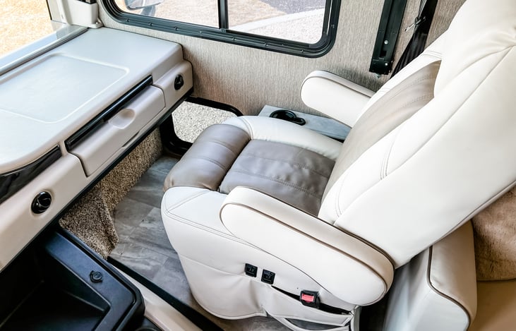 Passenger seat with pull out desk