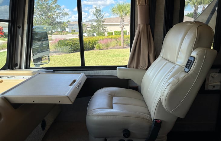passenger has a desk or table that pulls out for a laptop or whatever