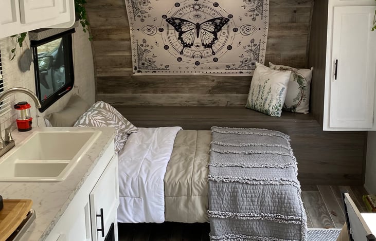 The small futon converts to a small bed. A twin air mattress is provided to set on top of it for comfort.