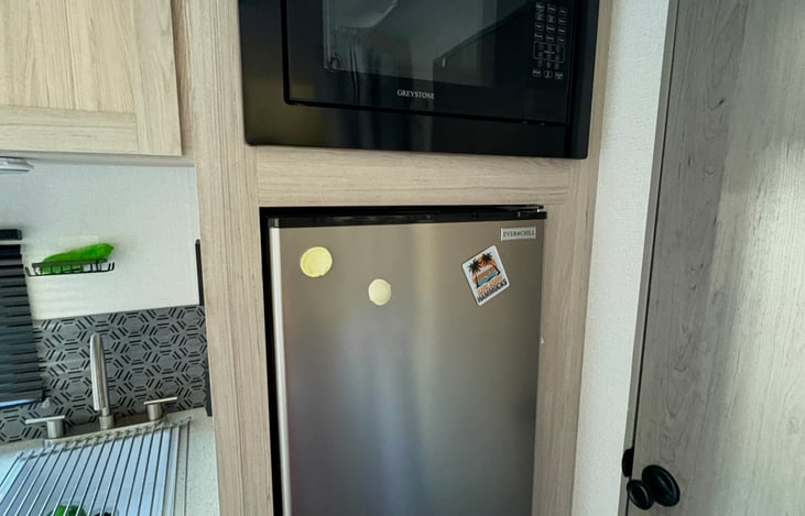 Compact fridge and microwave for easy meal prep during your trip.