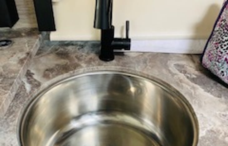 Kitchen sink with hot and cold water