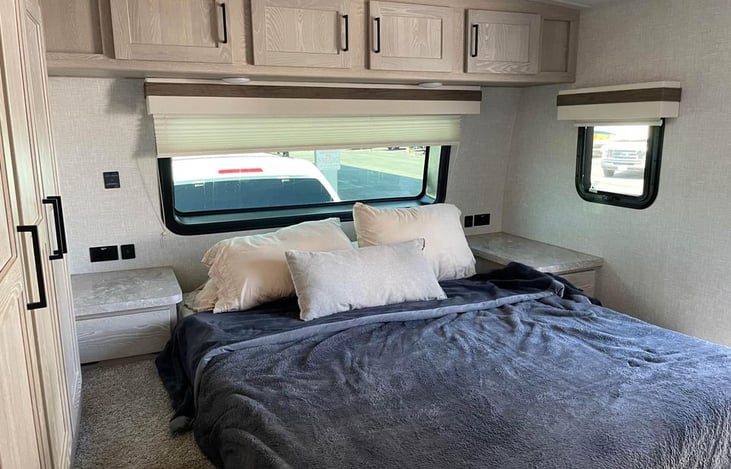 Enjoy your sleep with a Queen bed (60" x 74") includes a wardrobe, above storage and under mattress storage bin, and 32" smart TV mounted.