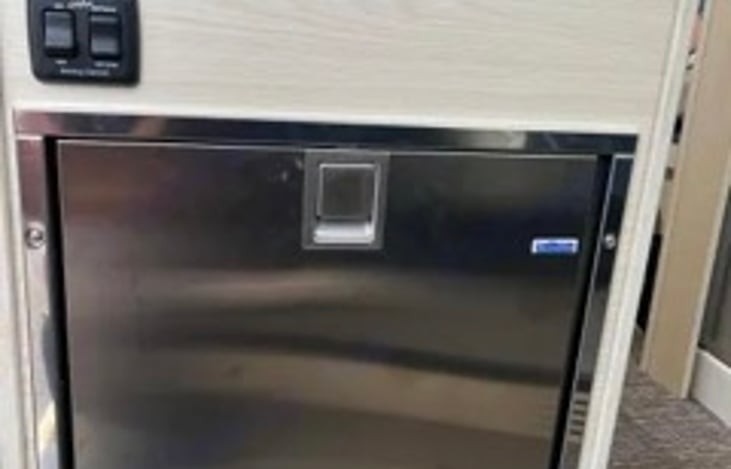 Dometic refrigerator and freezer is powered by AC and DC power sources.