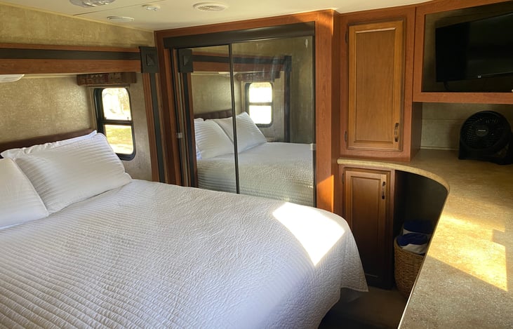 Private bedroom with queen bed and TV.  Linens provided.