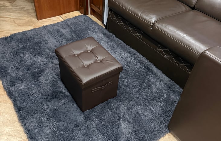 Indoor ottoman and rug, part of the deluxe camping package!