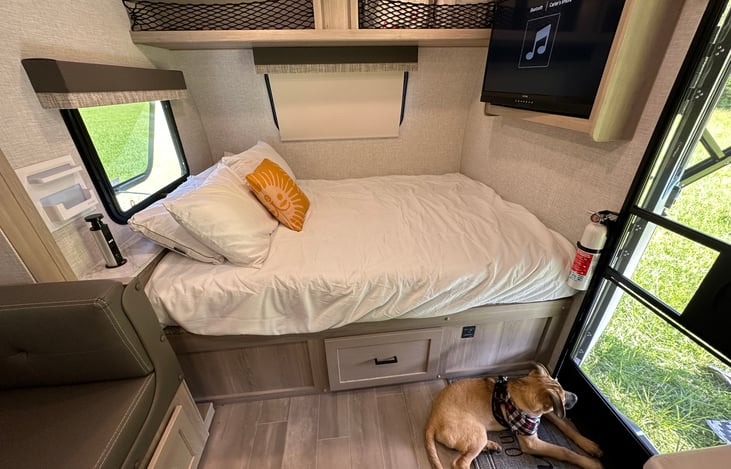 Full size bed with TV and storage