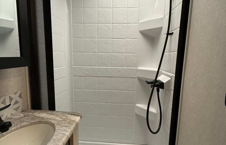 Stand up shower with plenty of room.