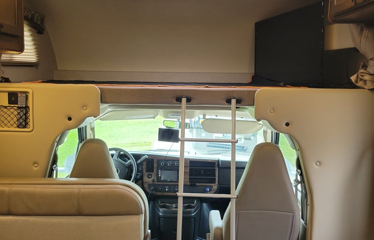 32" TV with DVD player and extra storage or sleeping space.