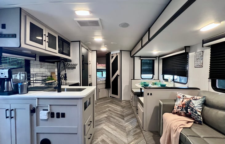 Very spacious and open with the slide out with a comfy couch and dinning area.