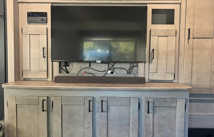 TV, download your favorite movies on your phone and you can hookup your phone right to the TV. Great for rainy days or to entertain the kiddos at night before bed. Also a lot of storage.