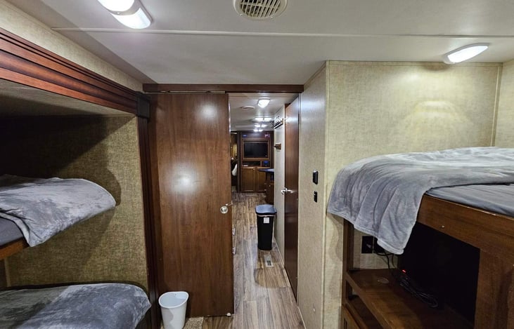 3 twin bunks can be closed off with door. Back room.