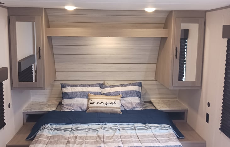 a cozy queen and lots of storage space all around