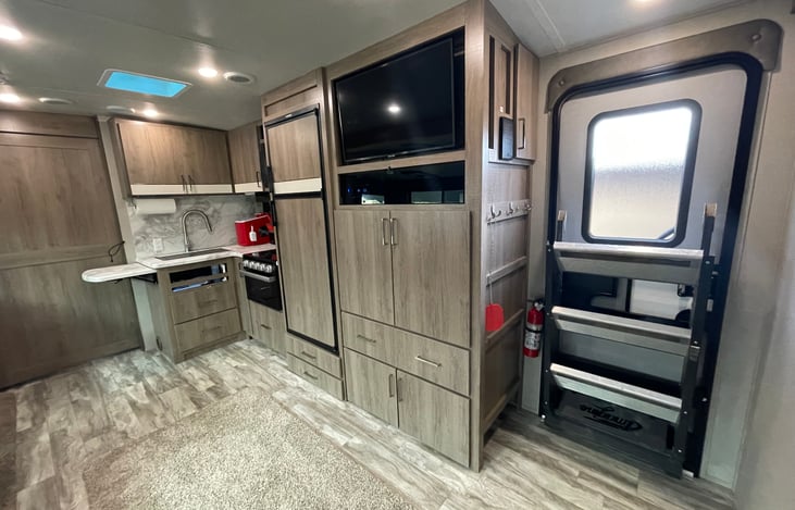 2nd Smart TV, Radio, DVD Player, CD Movies, Fly swatter, Fire Extinguisher, 2nd door.