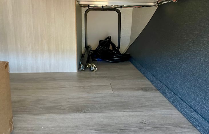 Below trailer storage area.