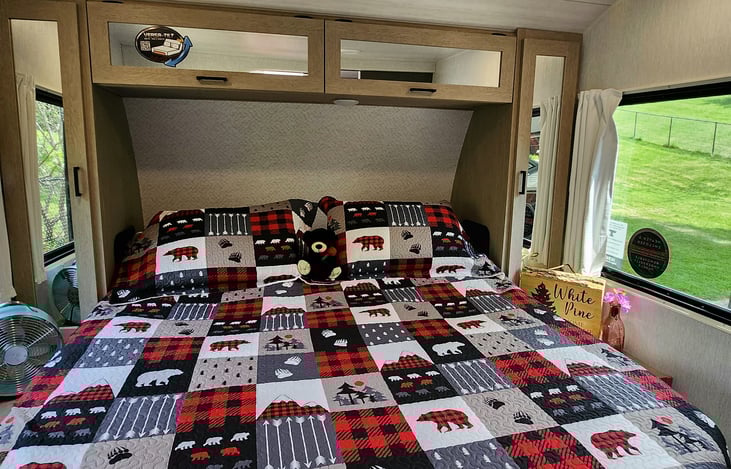 Bedroom has huge view windows on each side with privacy window blinds.