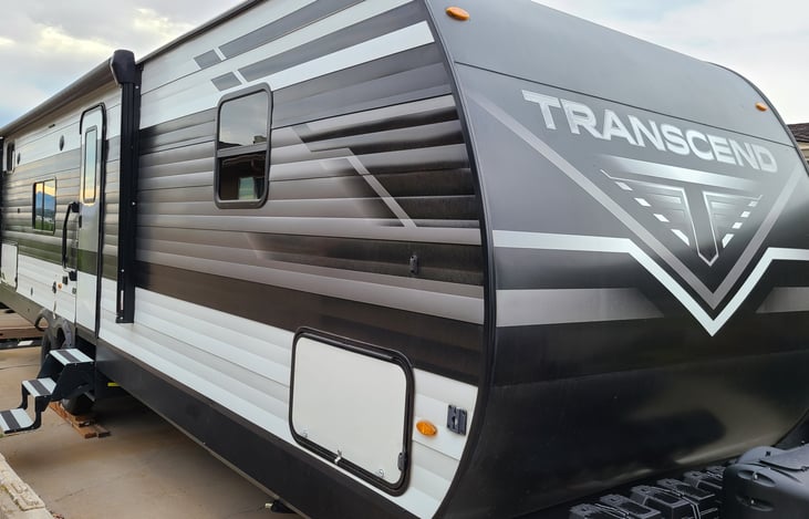 Has power awning and outdoor kitchen in rear compartment