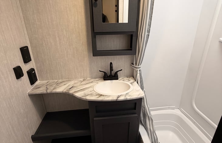 Large shower area with skylight and Insta Hot system so you have unlimited water. Bathtub for the younger kids. Sink and Toilet. Plenty of storage here.