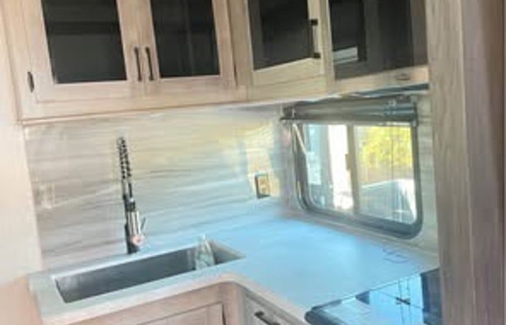 Fully equipped kitchen. Includes microwave,oven and stove w/ 3 burners.