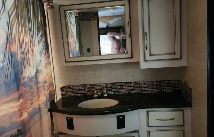 Large main bathroom with tub and shower.